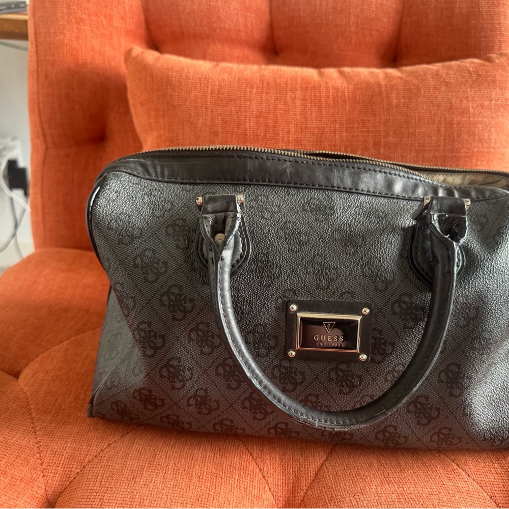 GUESS Logo Satchel – Black Monogram, “Est. 1981” Plaque, Top-Zip, Strap Included